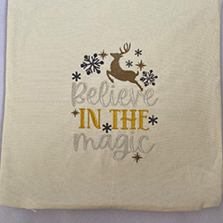 Embroidered cushion covers with Believe in the Magic and a reindeer on it