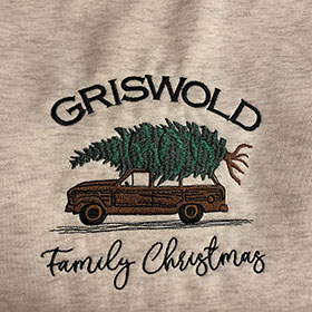 Embroidered T-shirt for the Griswold family Christmas with a tree strapped on top of a car